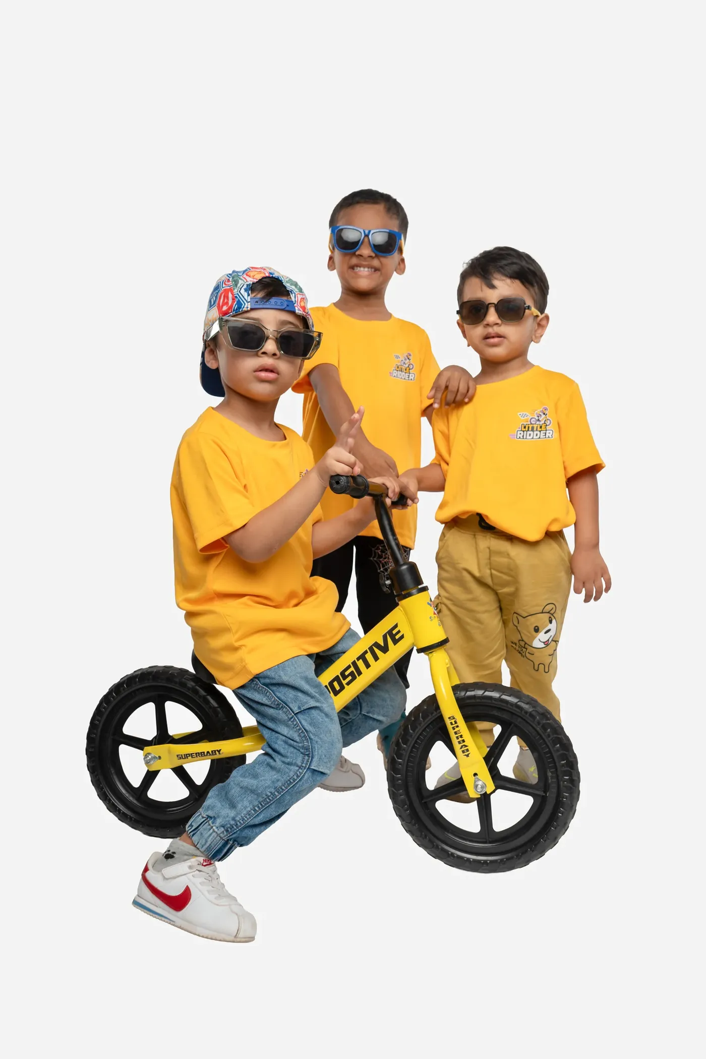 A young rider in the Pro category with a balance bike